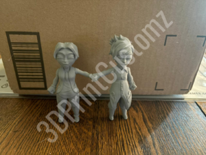 a couple of white statues 3DPrintCustomz Custom 3D Resin Printing