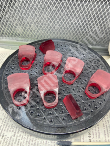 a group of pink plastic objects 3DPrintCustomz Custom 3D Resin Printing