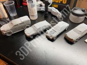 a group of toy vehicles on a table 3DPrintCustomz Custom 3D Resin Printing