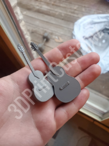 a hand holding a key 3DPrintCustomz Custom 3D Resin Printing