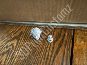 a pair of white shoes on a wooden surface 3DPrintCustomz Custom 3D Resin Printing