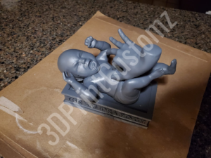a small metal statue 3DPrintCustomz Custom 3D Resin Printing