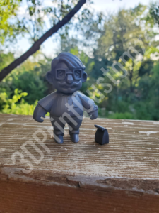 a toy figurine on a wood surface 3DPrintCustomz Custom 3D Resin Printing