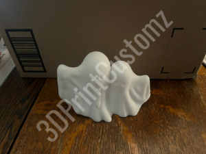 a white cube on a wood floor 3DPrintCustomz Custom 3D Resin Printing