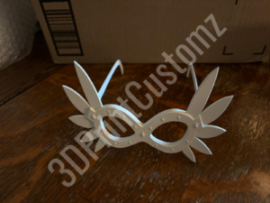 a white paper airplane on a wood surface 3DPrintCustomz Custom 3D Resin Printing