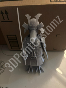 a white skeleton on a table 3DPrintCustomz Custom 3D Resin Printing