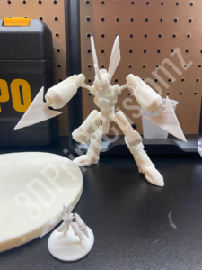 a white toy on a counter 3DPrintCustomz Custom 3D Resin Printing