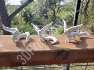 a group of white birds on a wooden surface 3DPrintCustomz Custom 3D Resin Printing