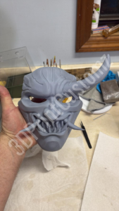 a hand holding a plastic model of a shark 3DPrintCustomz Custom 3D Resin Printing