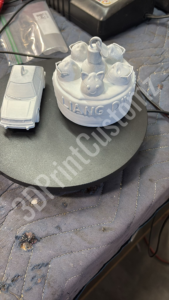 a white plastic model of a robot 3DPrintCustomz Custom 3D Resin Printing