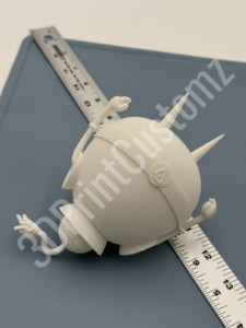 a white toy on a table 3DPrintCustomz Custom 3D Resin Printing